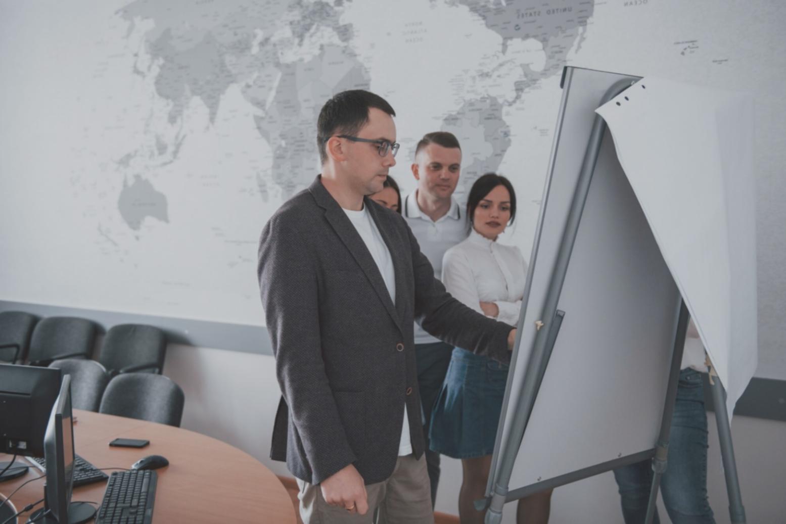 Professional presenting financial data to engaged business audience